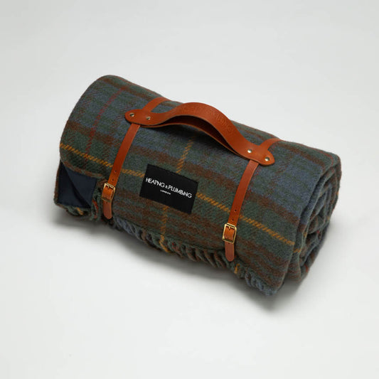 Classic khaki tartan from Scotland wool blanket with waterproof backing and tan short leather strap