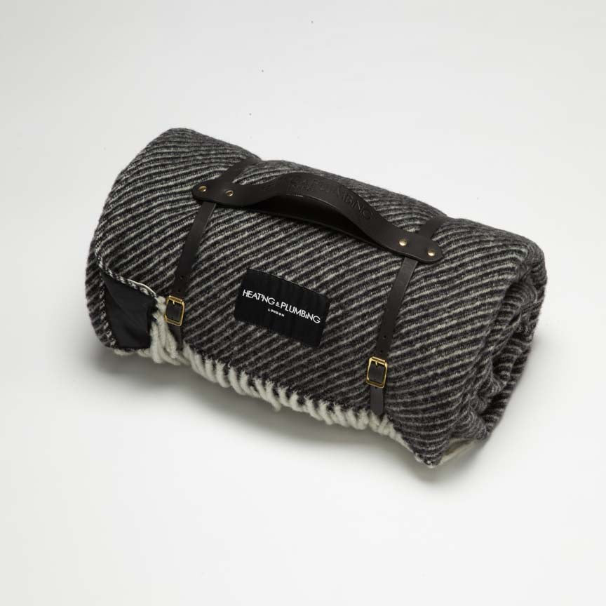 Black wool picnic blanket with black waterproof backing and black strap