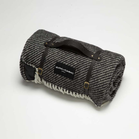 Black wool picnic blanket with black waterproof backing and black strap