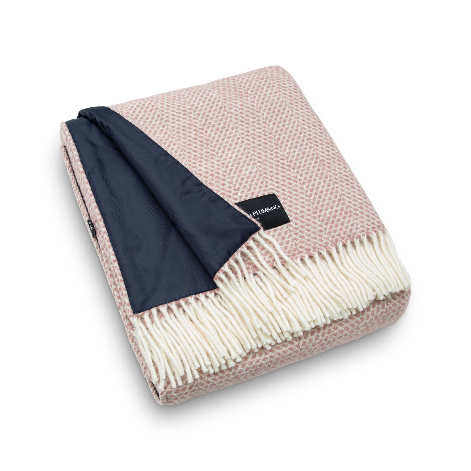 Dusky pink wool picnic blanket with cream fringe and waterproof navy backing, folded neatly – Heating & Plumbing London