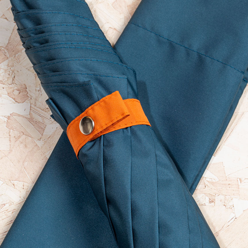 orange design detail on blue British umbrella