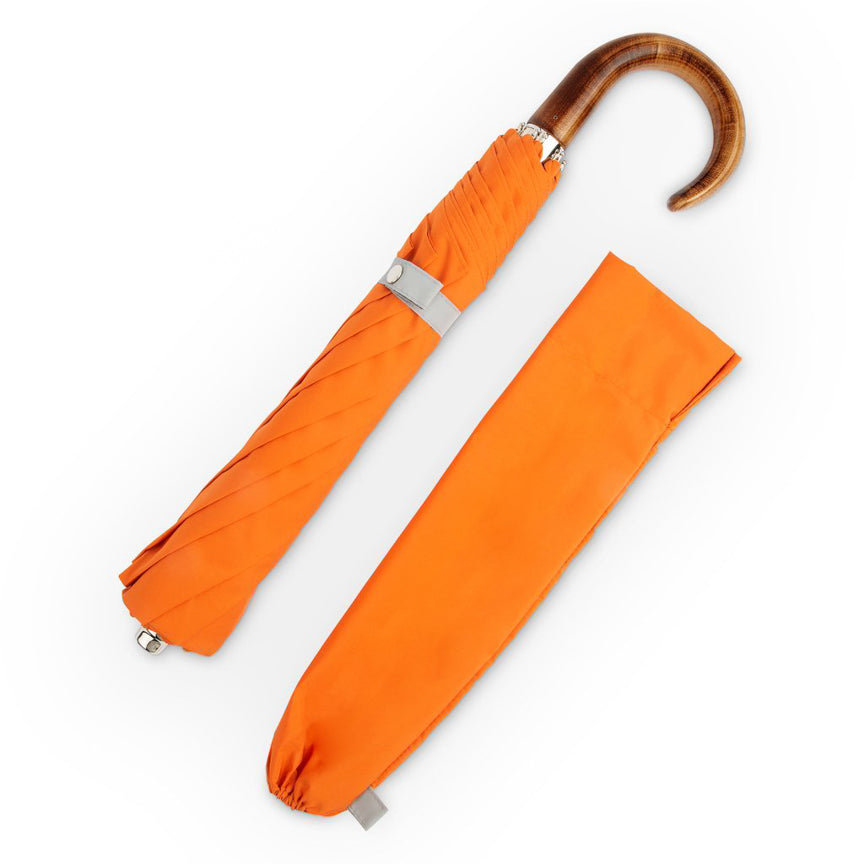 orange folding umbrella with wood handle