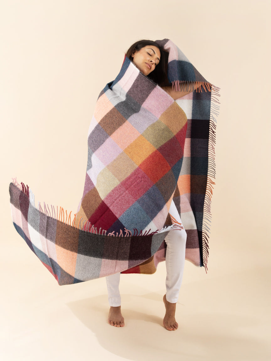 girl wrapped in alpaca throw
