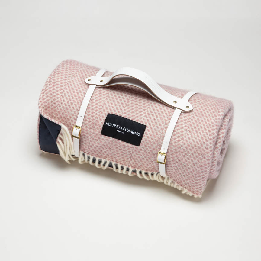 Dusky pink wool blanket combined with a stylish white leather strap and navy waterproof backing