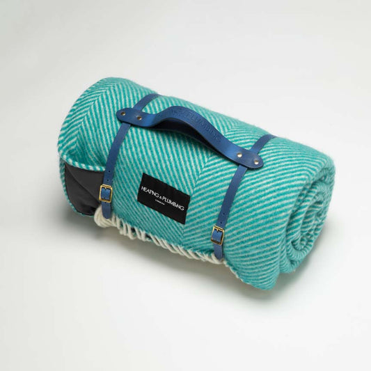 Teal blue wool blanket for picnics with stunning blue leather strap. 