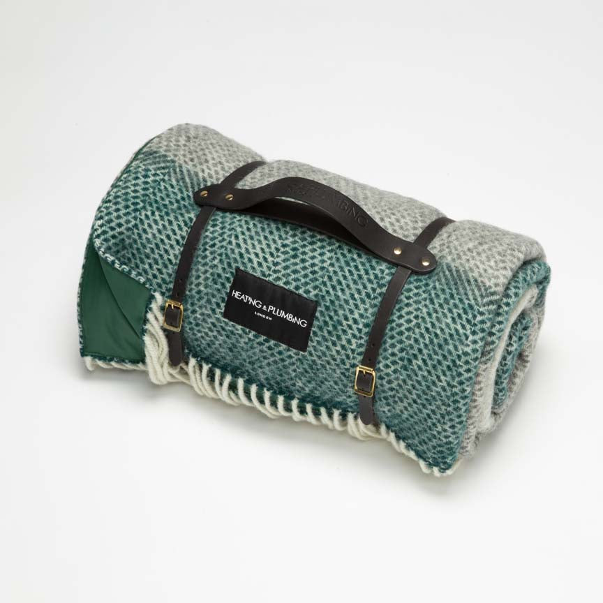 Stylish and classic Green and grey wool throw for picnic with green waterproof backing and black short leather strap