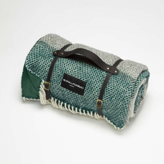 Stylish and classic Green and grey wool throw for picnic with green waterproof backing and black short leather strap