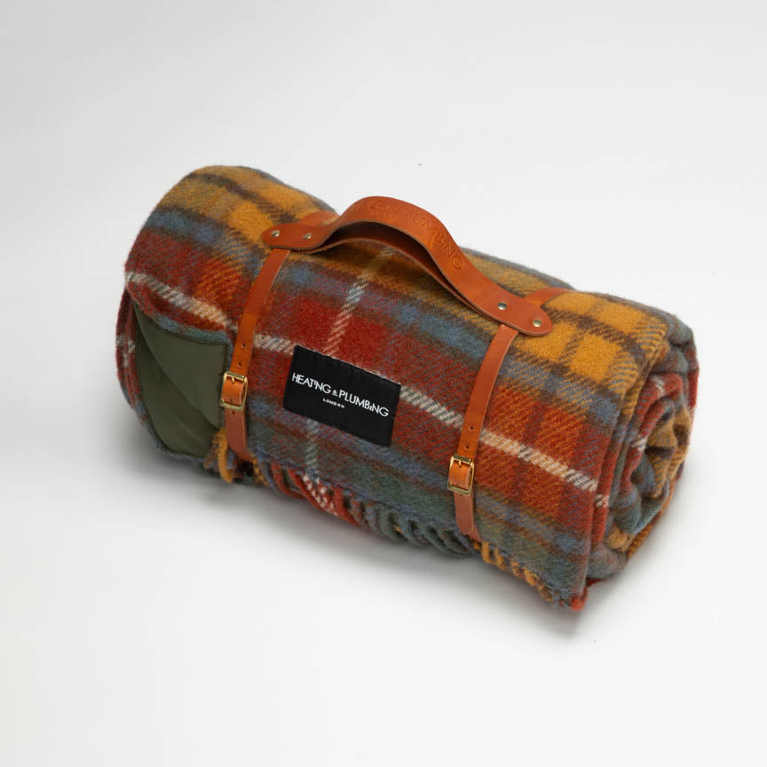 Classic tartan picnic blanket in pure new wool with a tan leather strap