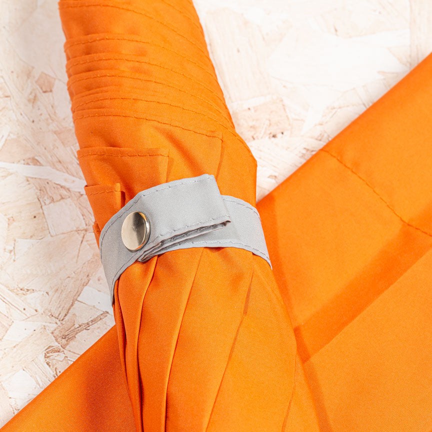 grey design detail on orange hand made umbrella