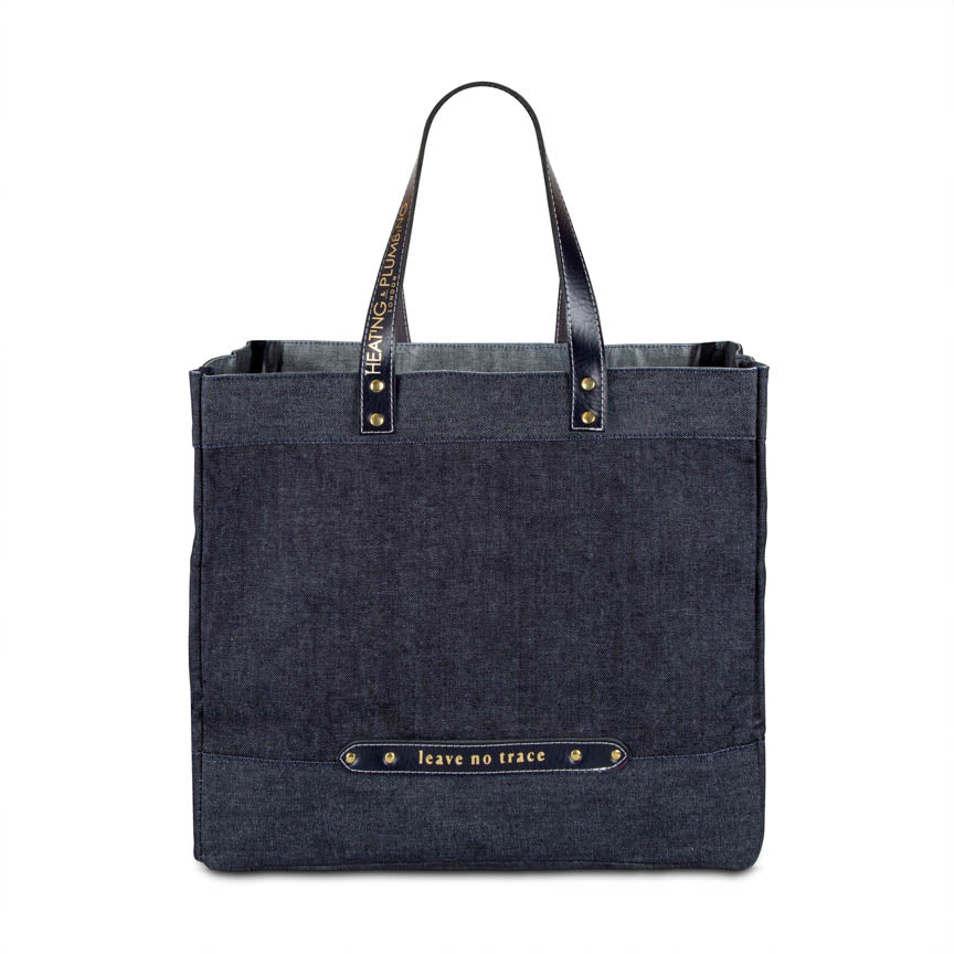 large denim shopping bag with black leather handles 