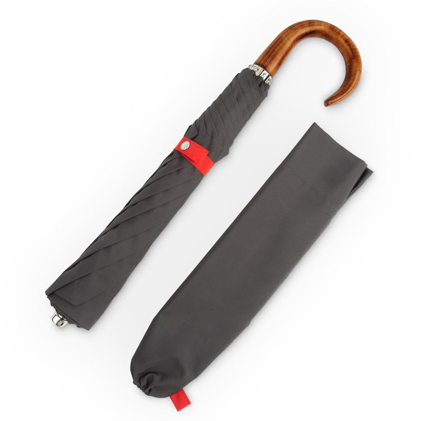 grey and red English umbrella with wood handle 