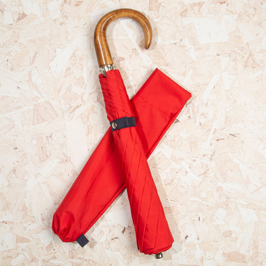red umbrella with scorched maple handle